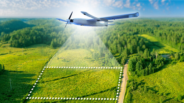 Aerial drone conducts land surveying and mapping, collecting geospatial data for agriculture, construction, and environmental monitoring.