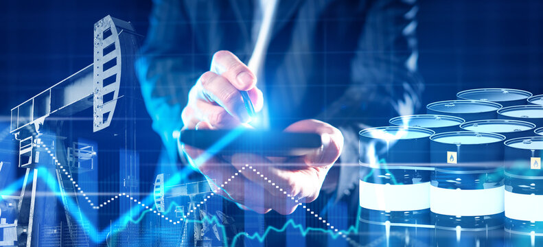 Oil industry analyst monitors production data and market trends using digital technology to manage energy resources and trading efficiency.