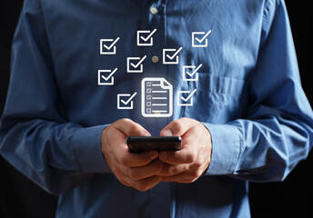 Man checking digital checklist on smartphone application