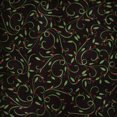 Elegant Christmas background with green holly leaves and red berries on a dark backdrop. Festive seamless pattern ideal for wrapping paper, holiday cards, and seasonal designs.