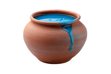 A clay pot filled with a vibrant blue liquid