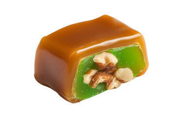 A green candy topped with nuts