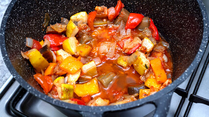 Close-up of a vegetable stew in a saucepan. Healthy food concept. Vegetarian food concept