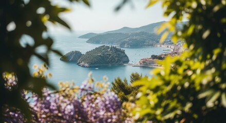 Scenic Mediterranean coastline with a picturesque seaside town. Luxury travel destination with a lush green island and harbor. Summer vacation concept viewed through blurred flowers
