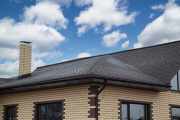 Soft roof, flexible shingles. Installation of soft tiles on the roof.