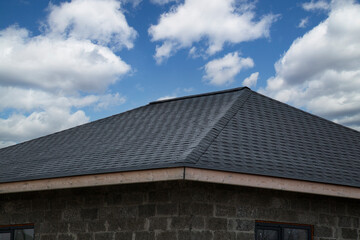 Soft roof, flexible shingles. Installation of soft tiles on the roof.