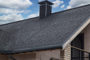 Soft roof, flexible shingles. Installation of soft tiles on the roof.