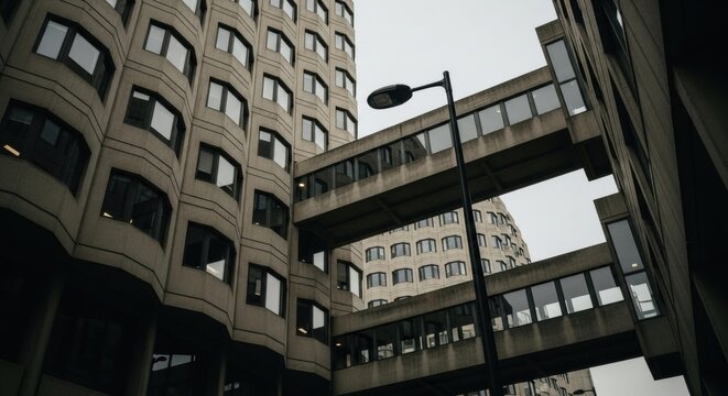Brutalist architecture with concrete facade. Geometric building exterior and connecting skywalk bridges. Modernist corporate office complex. Stark urban infrastructure and dystopian city concept - Powered by Adobe
