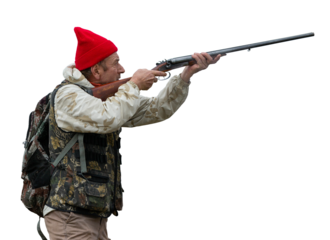 An adult hunter hunts in the autumn countryside. He fires a shotgun.