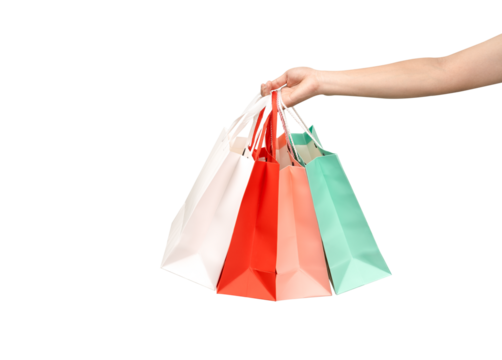 A person's hand holding a paper shopping bag with handles on a clean white background. Studio shot with ample copy space for text, logos, or branding. Isolated on white, cut out. - Powered by Adobe