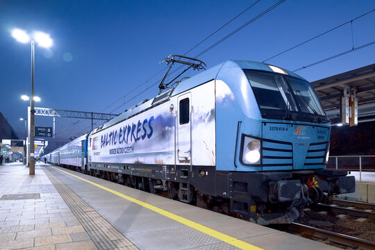 Poznan, Poland - November 8, 2025. A Siemens Vectron locomotive in the livery of PKP Intercity leading the Baltic Express train from Prague Main Station to Gdynia Main Station.