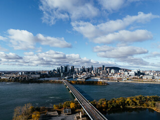 Aerial view of Montreal Old Port, downtown, historic buildings and waterfront under blue sky. g.