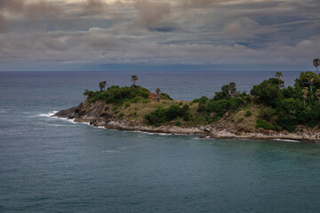 Beautiful marine nature of Thailand. Waves on the ocean. Green tropical island. Blue clear sky.	
