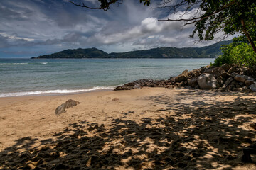 Beautiful marine nature of Thailand. Waves on the ocean. Green tropical island. Blue clear sky.	
