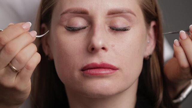Portrait Female adult caucasian after extension eyelash with led treatment in spa setting.