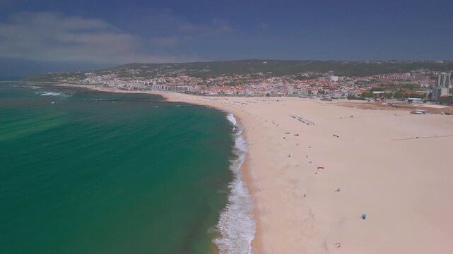 Aerial footage of  the beach of Figueira da Foz and the city, It is a coastal city with several beaches, summer and seaport facilities on the Atlantic Ocean coast.