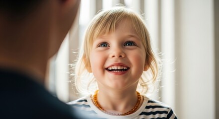 Adorable Caucasian toddler girl with a bright smile. Parent and child interaction. Family bonding and connection concept. Pediatric healthcare and childhood development
