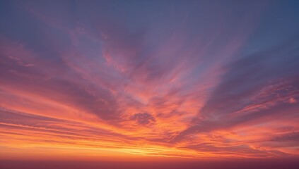 Obraz premium Vibrant sunset paints the sky with fiery oranges and soft purples, creating a breathtaking natural spectacle.