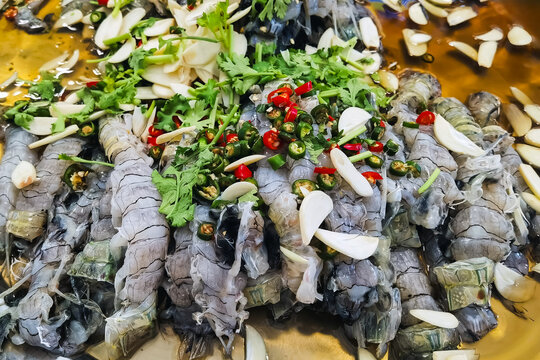 Mantis shrimp in fish sauce. Mantis shrimp and spicy sauce, seafood thailand (spicy salad shrimp in fish sauce). Fresh shrimp with lime, coriander, chilli, garlic and fish sauce. Spicy crayfish salad.