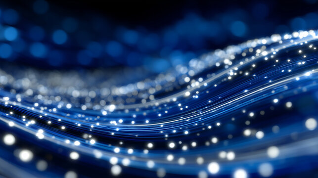 Dynamic luminous waves made of light trails and sparkling dots curving gracefully across a deep blue abstract background, symbolizing technology and innovation