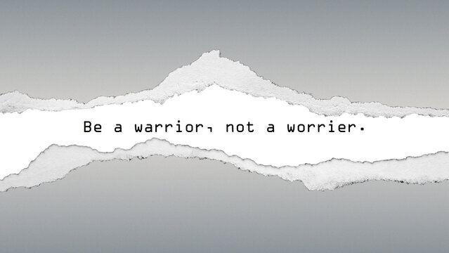 Motivational quote “Be a warrior, not a worrier” on gray torn paper background. Minimalist design symbolizing strength, courage, and self-belief.
