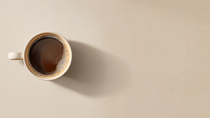 Top view of a single coffee cup on a beige background, minimalist flat lay design with soft natural light and simple aesthetic for modern lifestyle concept.