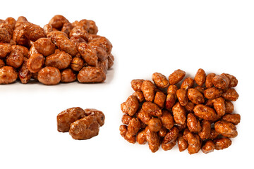 Tasty sweet roasted peanuts isolated on a white background.