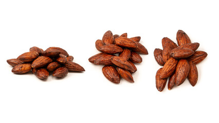A group of caramelized almonds isolated on a white background.