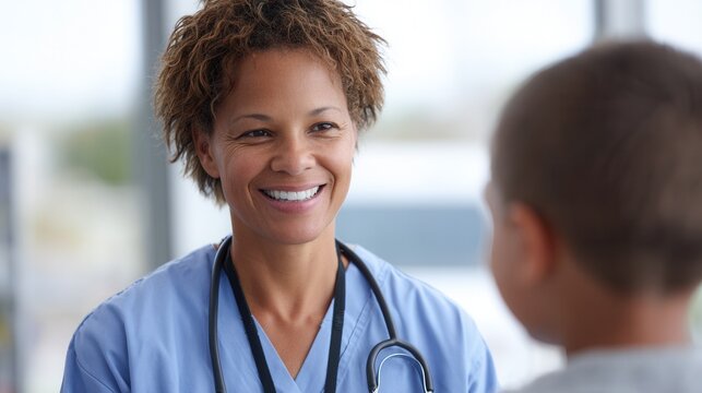 A friendly healthcare professional engages with a young boy in a medical setting, promoting a warm and caring atmosphere.