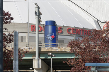 Fototapeta premium compressed view of Rogers Centre Stadium and Toronto Blue Jays logo seen from the waterfront (Queens Quay W)