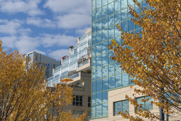 Fototapeta premium contrast of buildings and textures (left) King's Landing at 460 Queens Quay W and (right) 10 Lower Spadina Ave, Toronto