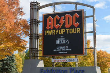 Fototapeta premium Exhibition Place digital roadside billboard featuring a concert promotion for AC/DC PWR/UP Tour (September 16, 2026)