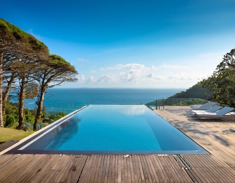 luxury infinity pool overlooking ocean at modern villa tranquil coastal retreat