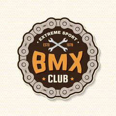 Fototapeta premium Bmx extreme sport club badge, patch, sticker. Vector. Concept for shirt, logo, print, stamp, tee with sprocket, chain. Vintage typography design with wrench and chain silhouette.
