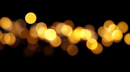 Soft glowing yellow Christmas lights blurred on dark black background, festive bokeh