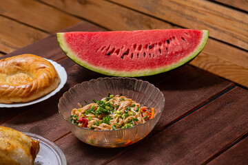 Couscous with dried fruits and turmeric, whole baked chicken flatbread