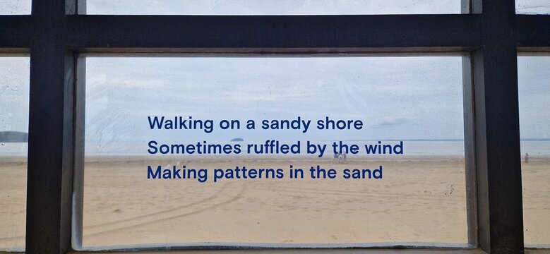 Sandy beach with a moving quote
