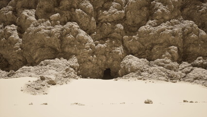 A hidden cave entrance reveals itself in a vast sandy desert. Surrounding cliffs are textured with rocky formations, contrasting the smooth sand nearby, as sunlight casts soft shadows.