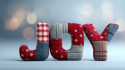patchwork christmas concept. Textured letters spelling "JOY" with a soft background glow.