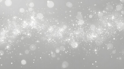Abstract shimmering white and silver glitter dust particles with soft bokeh lights creating a magical and ethereal glow on a gray background