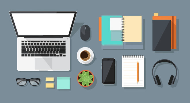 Modern Desk Setup with Laptop, Coffee, and Office Supplies - Top View