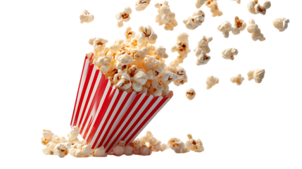 A red and white striped popcorn box tipped over spilling popcorn on transparent background