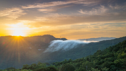 Experience a stunning summer sunrise in Xindian, New Taipei City, Taiwan. Admire the orange sky and...