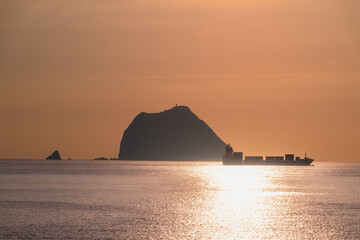 A stunning video of a cargo ship sailing past Keelung Islet at sunrise Filmed from Waishuangxi...