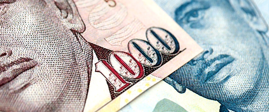 Singapore Dollar currency money bills. SGD currency banknotes in pile with different denomination close up