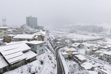 Obraz premium Townscape of town Yudanaka during wintertime in the snow, Nagano region in Japan. Place of Snow monkey park