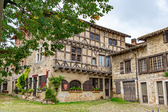 PEROUGES, FRANCE - SEPTEMBER 25, 2025: Arhitecture of Perouges, old houses made of wood and stone. Medieval walled town, a popular touristic attraction.