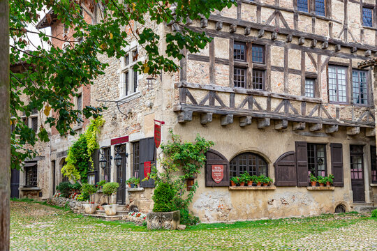 PEROUGES, FRANCE - SEPTEMBER 25, 2025: Arhitecture of Perouges, old houses made of wood and stone. Medieval walled town, a popular touristic attraction.