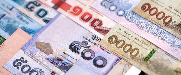 Thai Baht currency money bills. THB currency banknotes in pile with different denomination close up