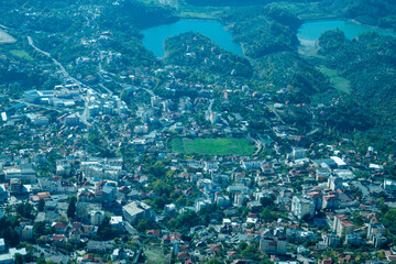 Krujë, Albania – November 2, 2025 – A view of Kruja town from the slopes of Mount Kruja, showing the historic hillside settlement and surrounding landscape.